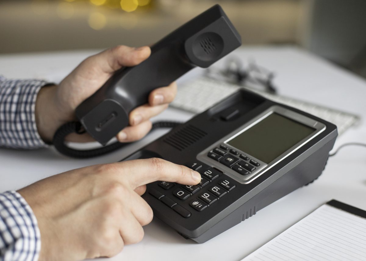 close-up-businessman-dialling-phone-number-1200x857.jpg
